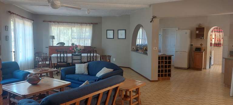 Main house open plan lounge kitchen dining area 768x346
